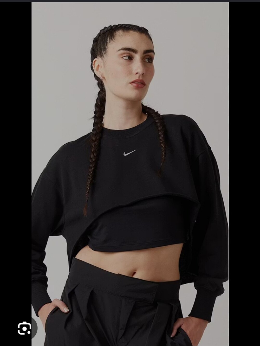 Nike black cropped crewneck sweatshirt with a center swoosh logo.